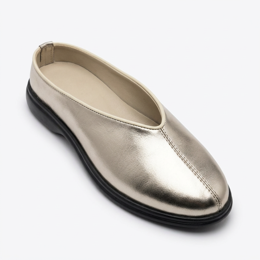 Single champagne-silver metallic slip-on shoe with centre seam on white